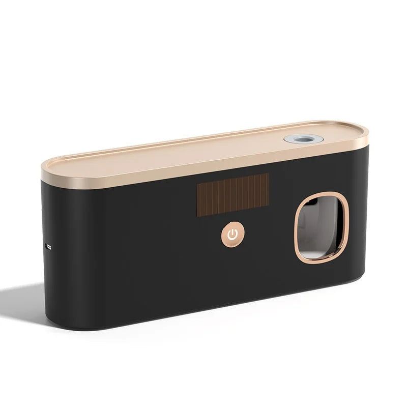 Black and rose gold electronic device on a white background