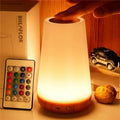 Futuristic night light with remote control on a wooden surface