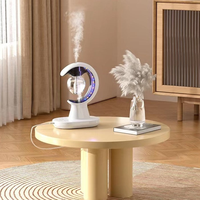 Modern interior with a round table featuring a decorative lamp and plant.